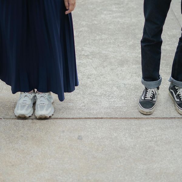 A calendar and a pair of comfortable sneakers side by side.